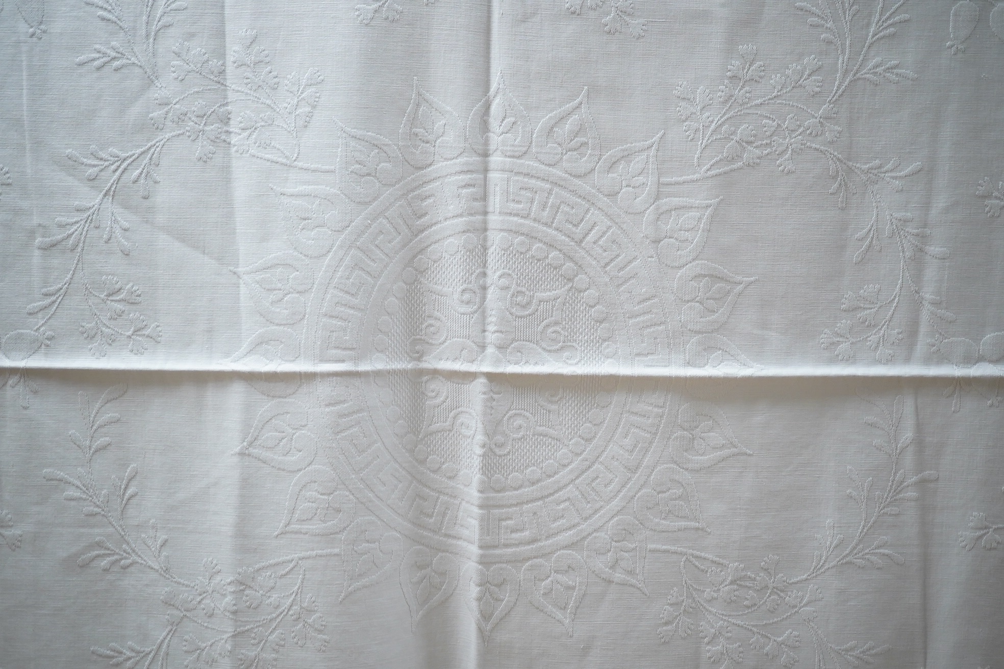 Three late 19th century white linen ‘Marcella’ style bedcovers, with inspired Christopher Dresser floral textile designs.